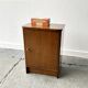 A vintage 1950/60s petite compact oak bedside cabinet