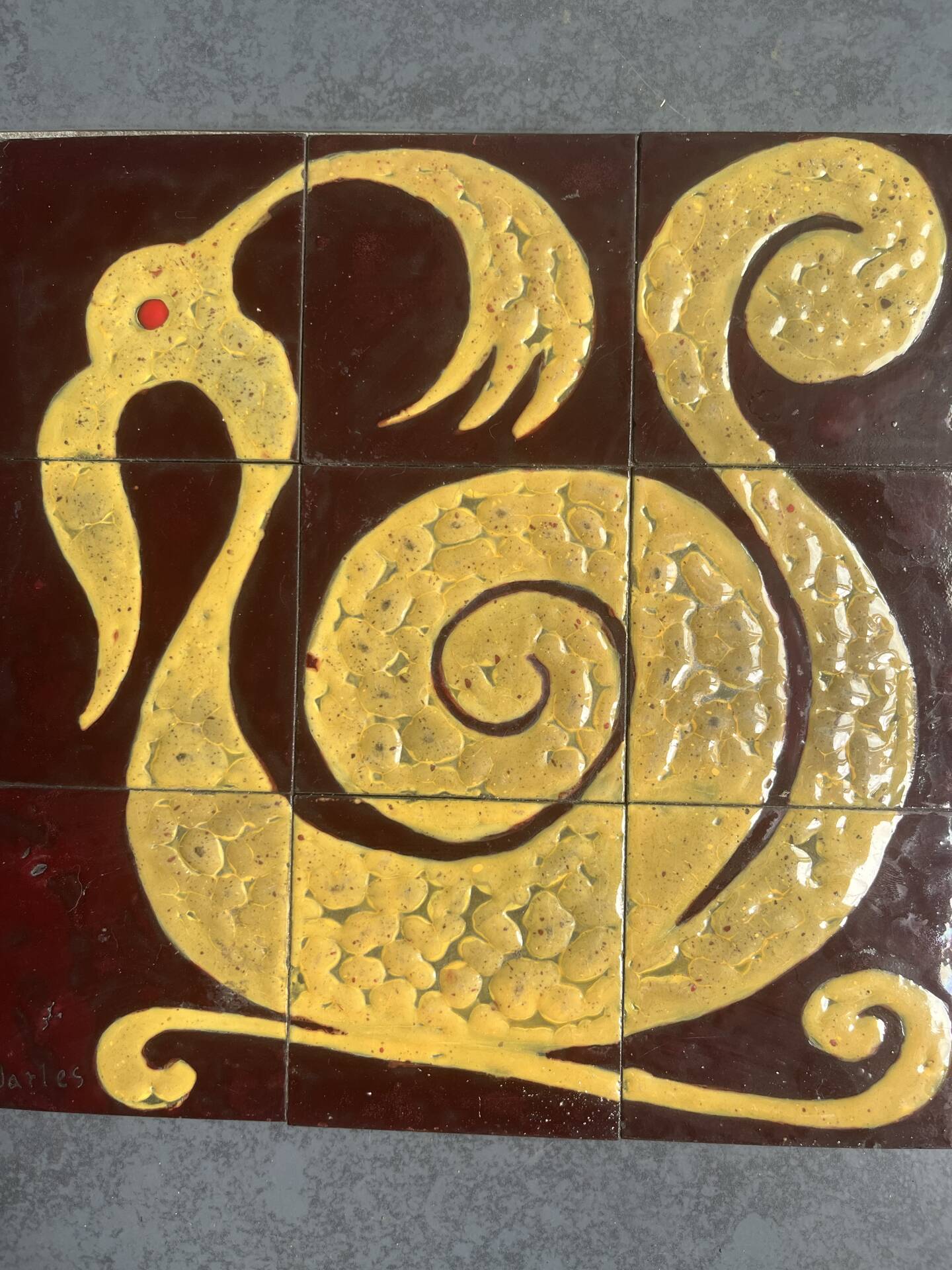 Ceramic plaque with zoomorphic pattern made up of 9 tiles.