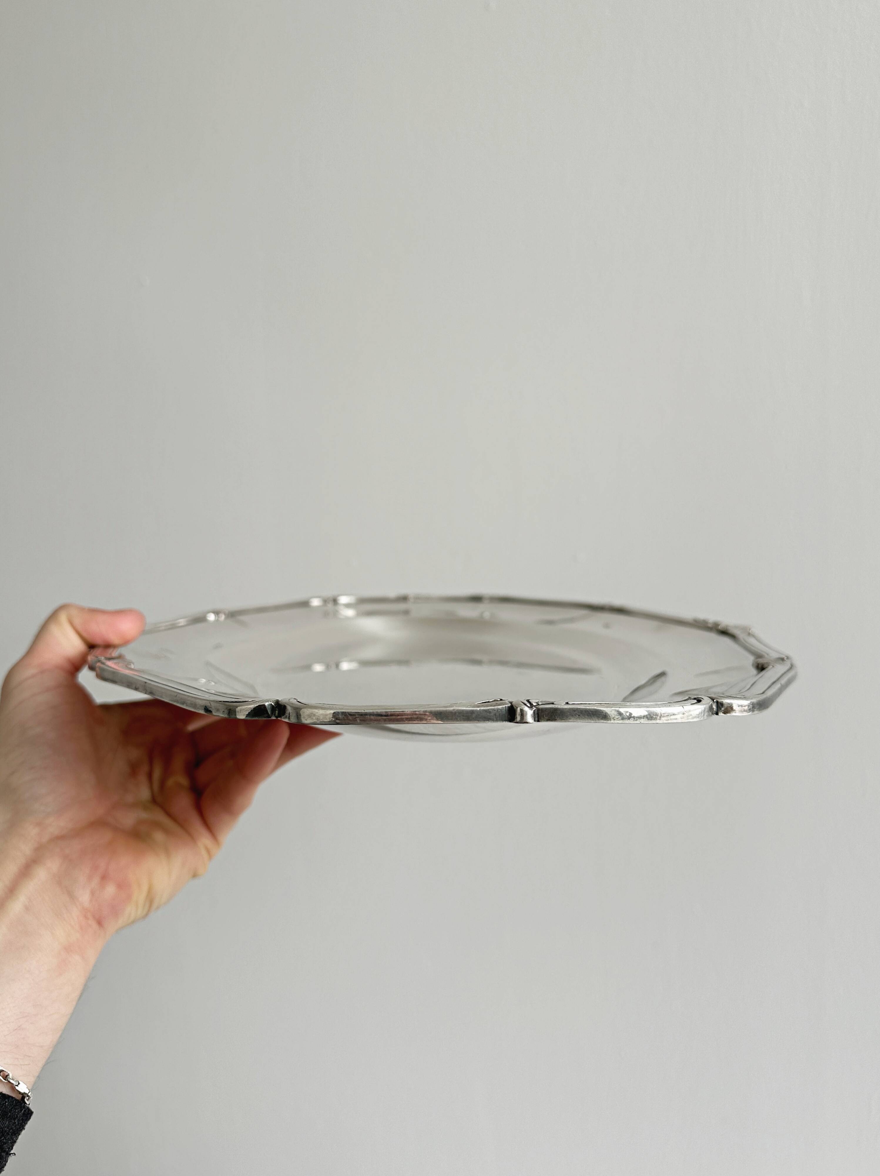oval silver metal plate
