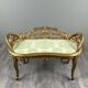 Louis XV style bench in carved and gilded wood, 20th century.