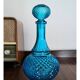 Bouteille en verre bleu belge vintage