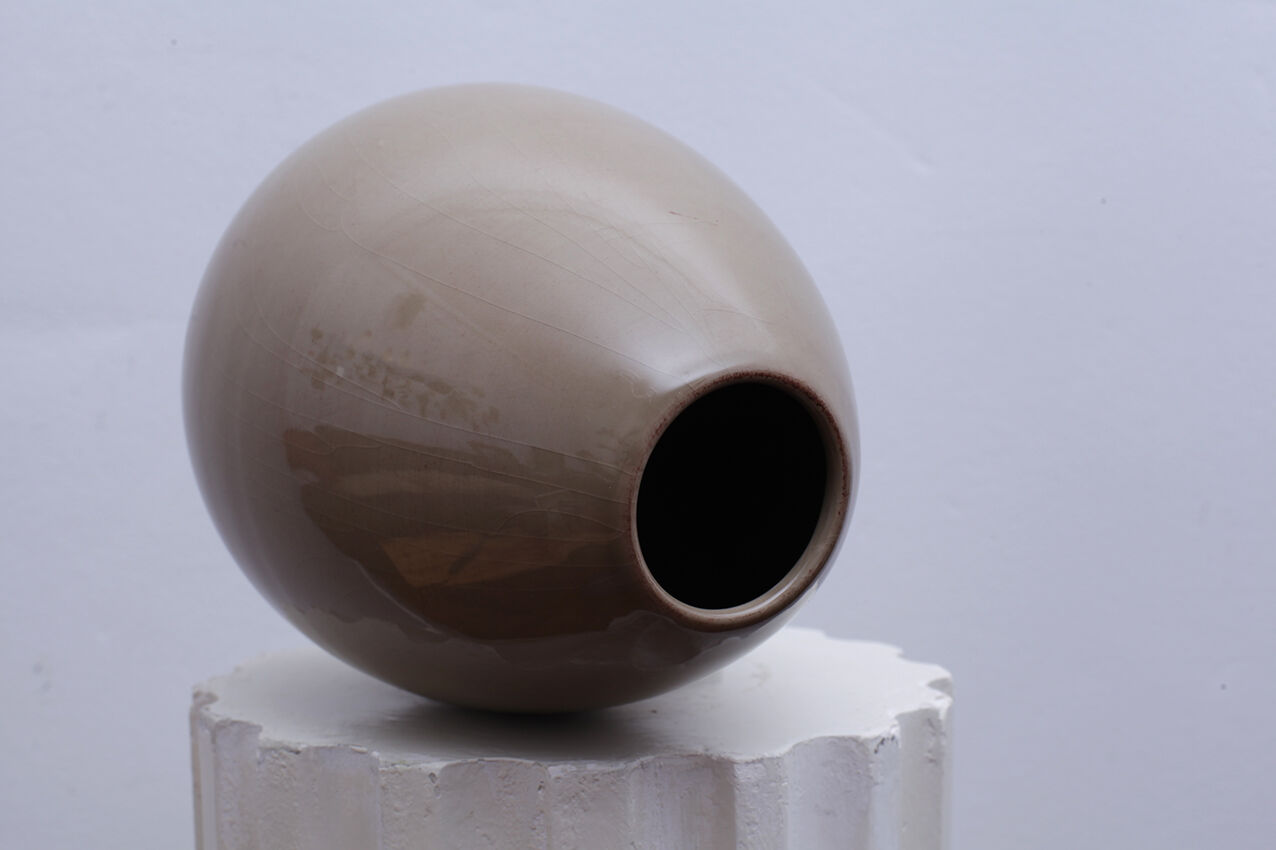 Beige ceramic vase egg shape
