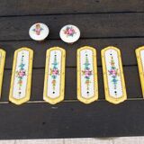Set of 2 porcelain door handles and cleanliness plates