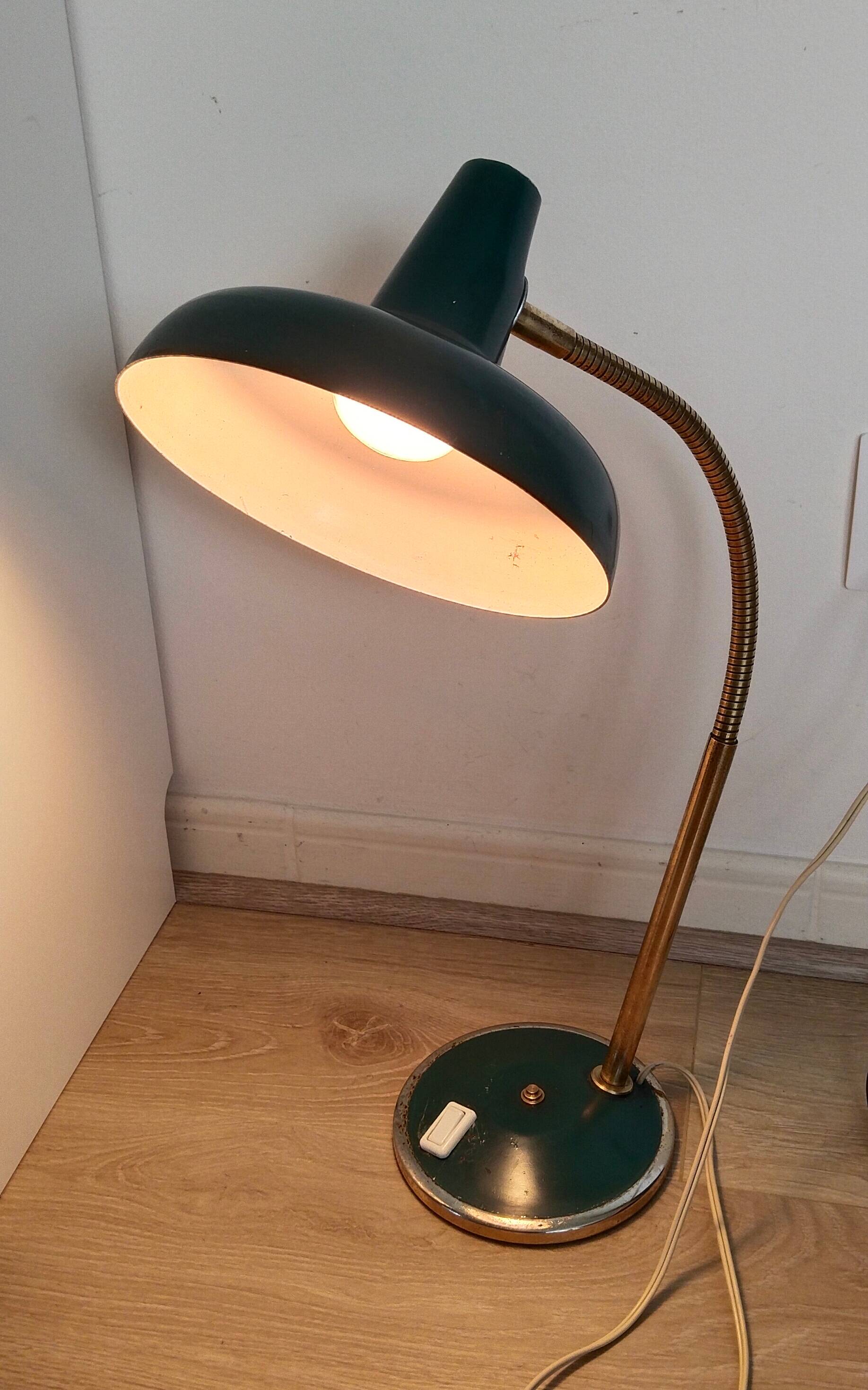 Green and gold articulated desk lamp
