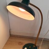 Green and gold articulated desk lamp