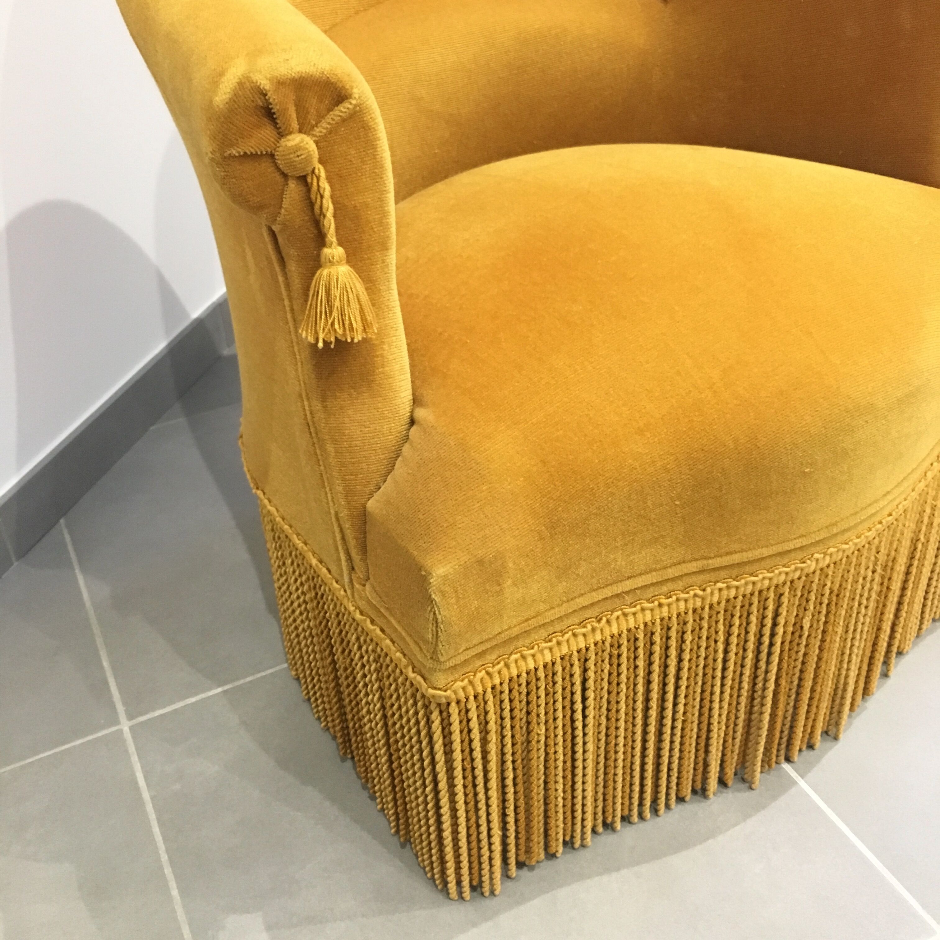 Pair of velvet fringed low chairs