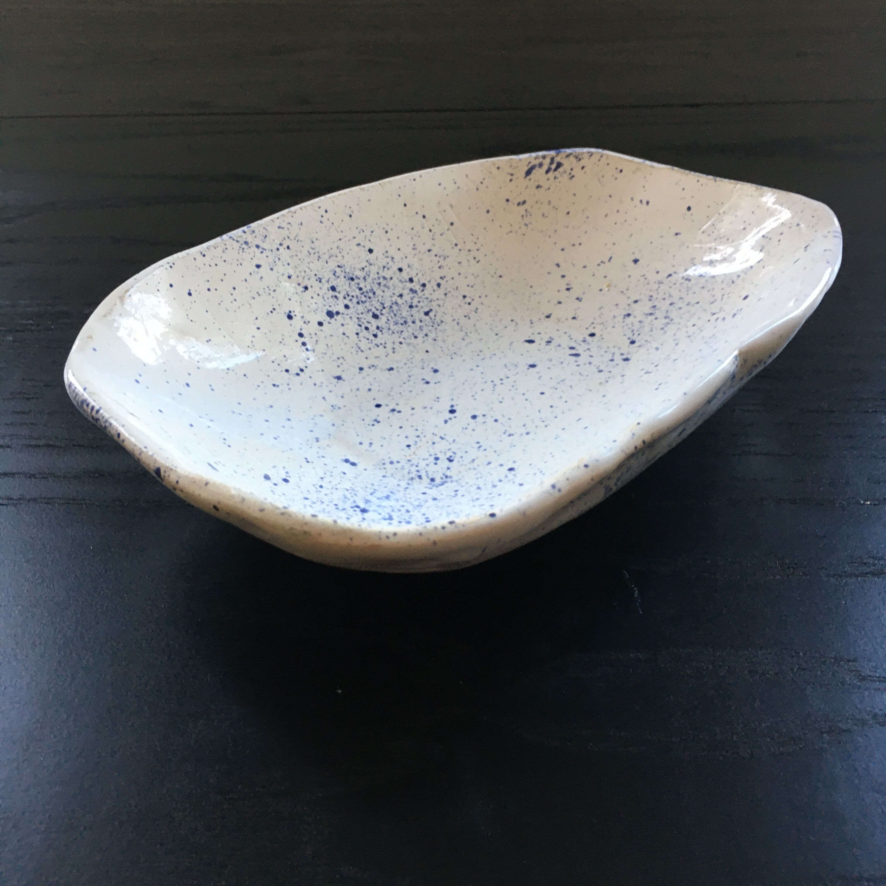 Empty blue speckled white pocket