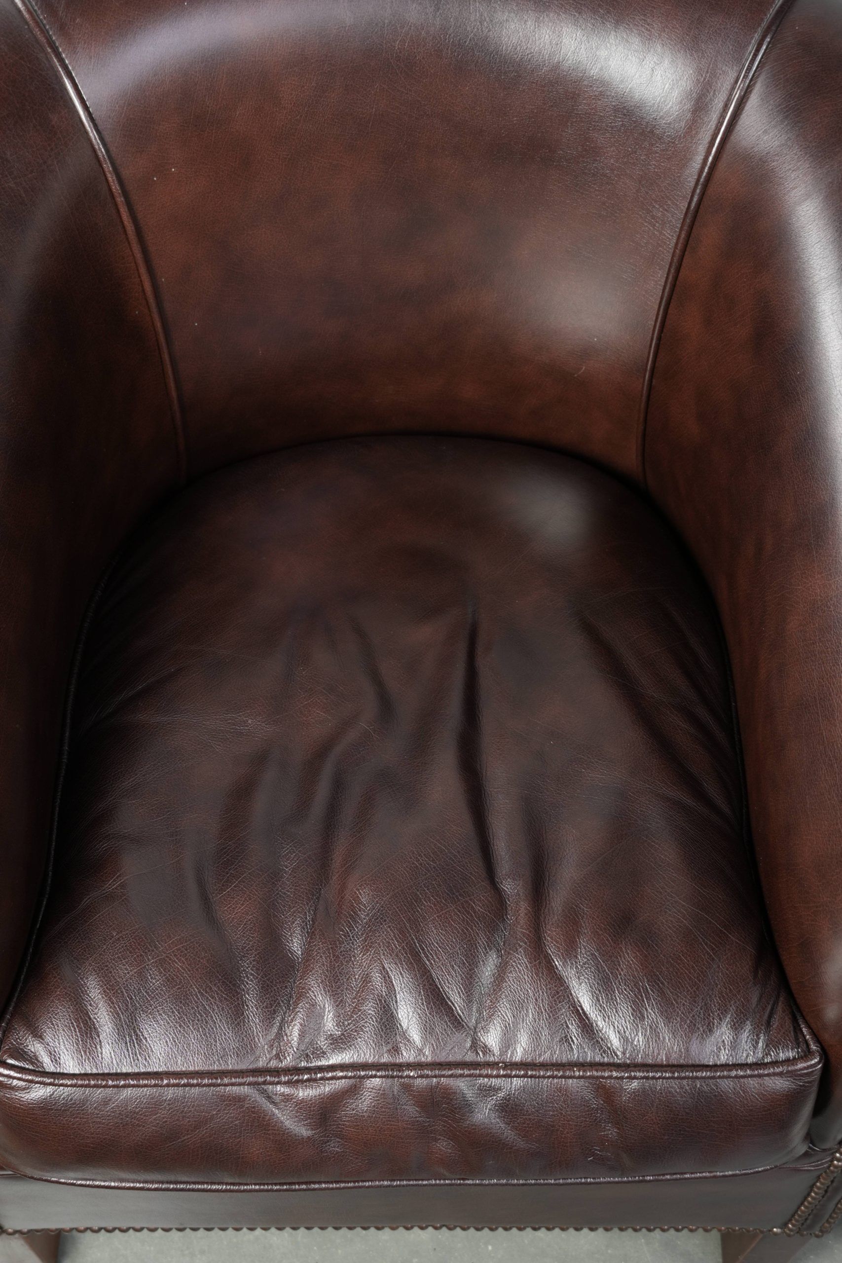 Set of two cowhide club armchairs in good condition with a English design