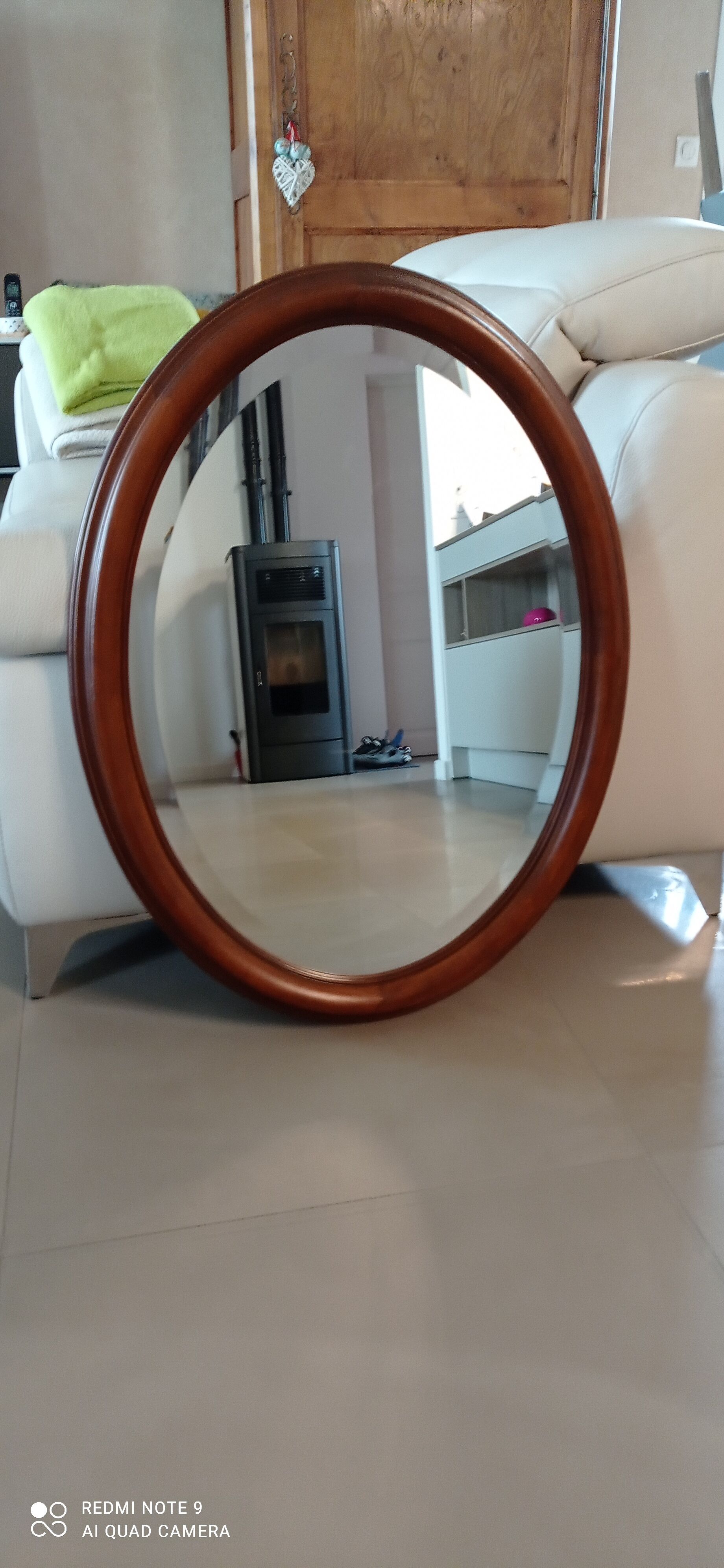 Old beveled oval mirror in excellent condition
