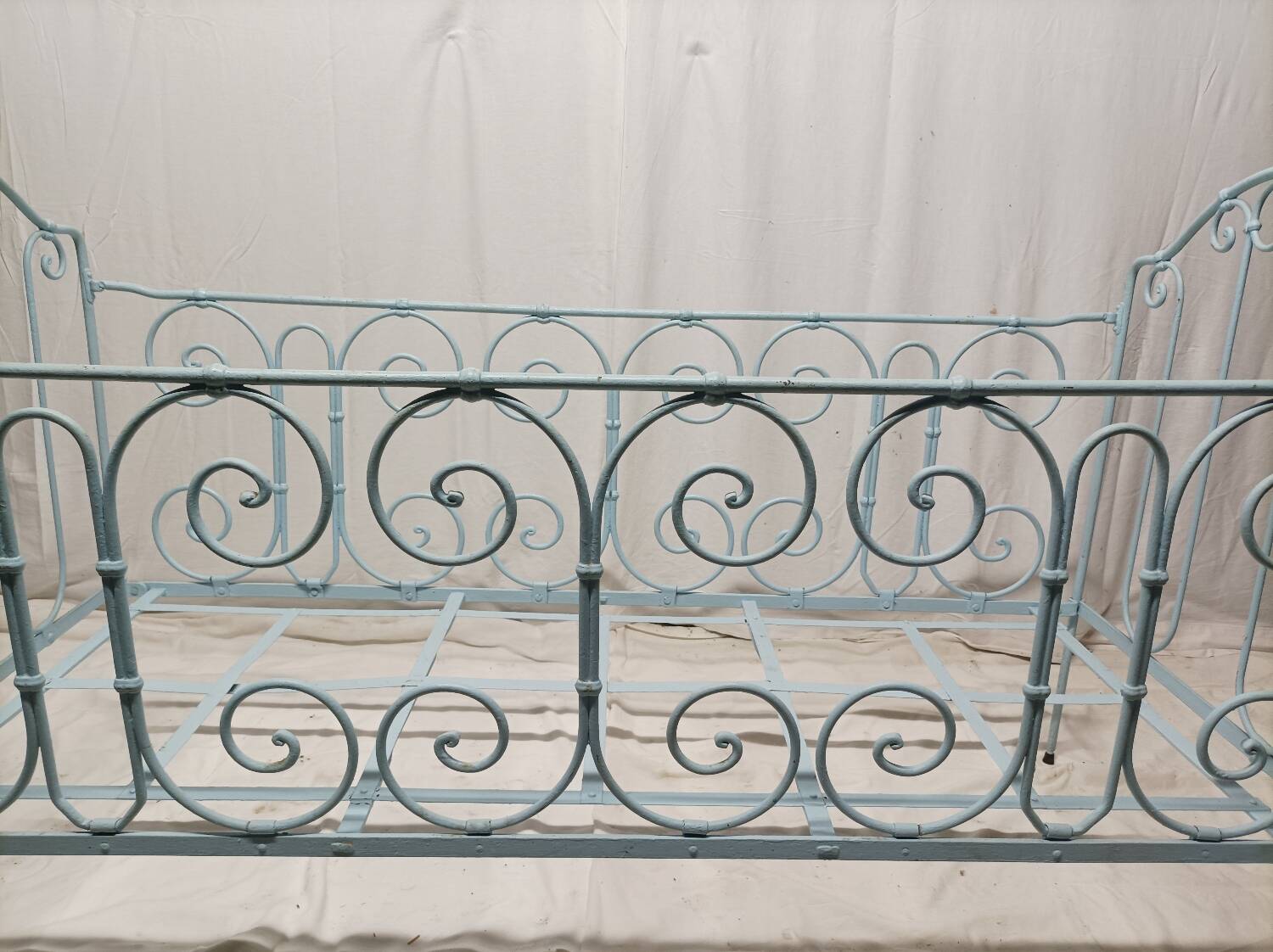 Old children's bed with metal bars