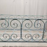 Old children's bed with metal bars