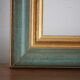 Frame in gilded and green wood