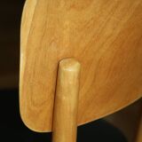 5 baumann chairs with large backs in black faux leather.