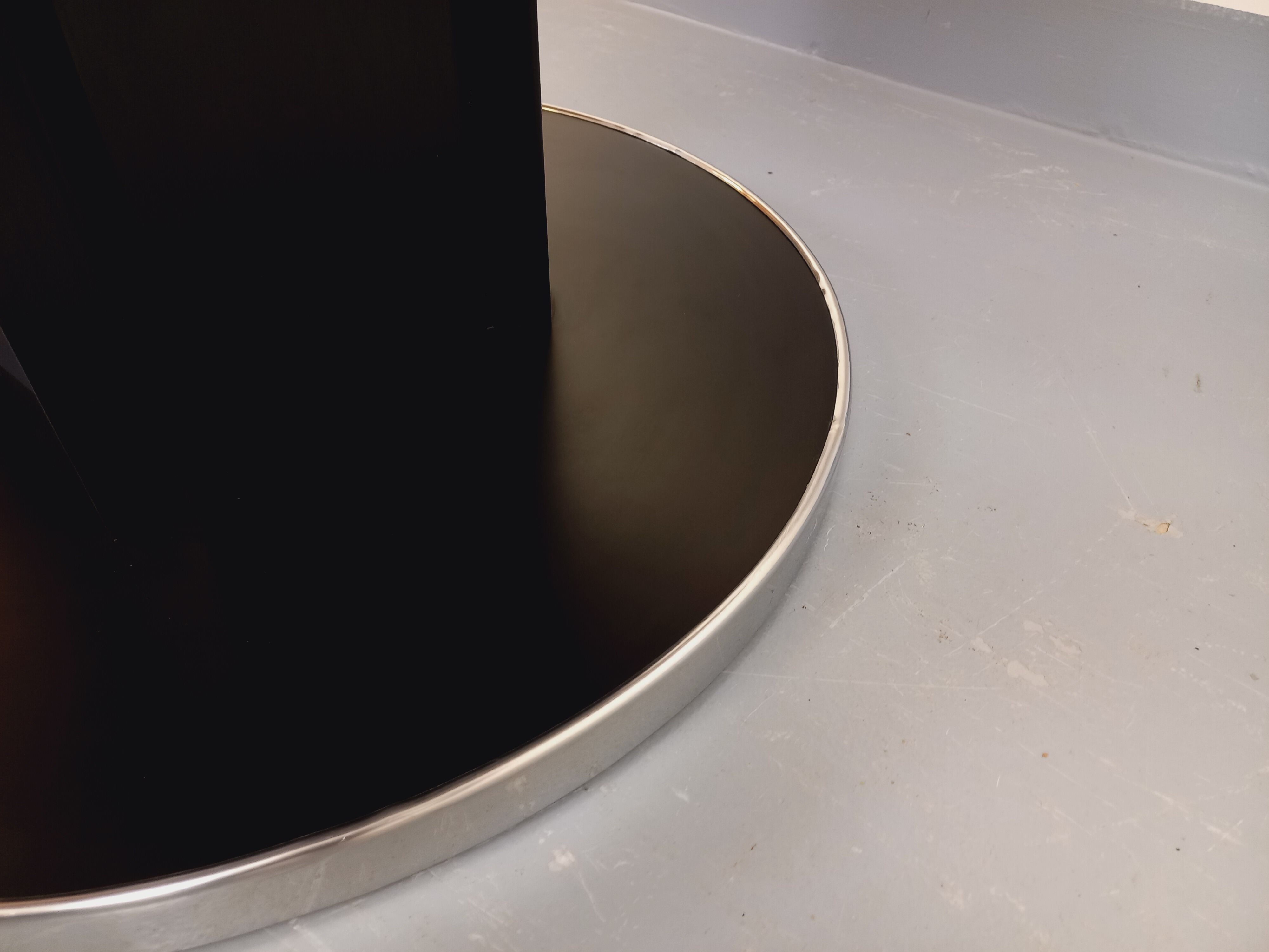 Vintage dining table in melamine with a black wood effect and chrome metal.
