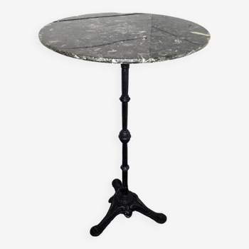 Standing bistro dining table with cast iron base and marble top