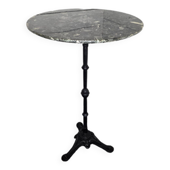 Standing bistro dining table with cast iron base and marble top