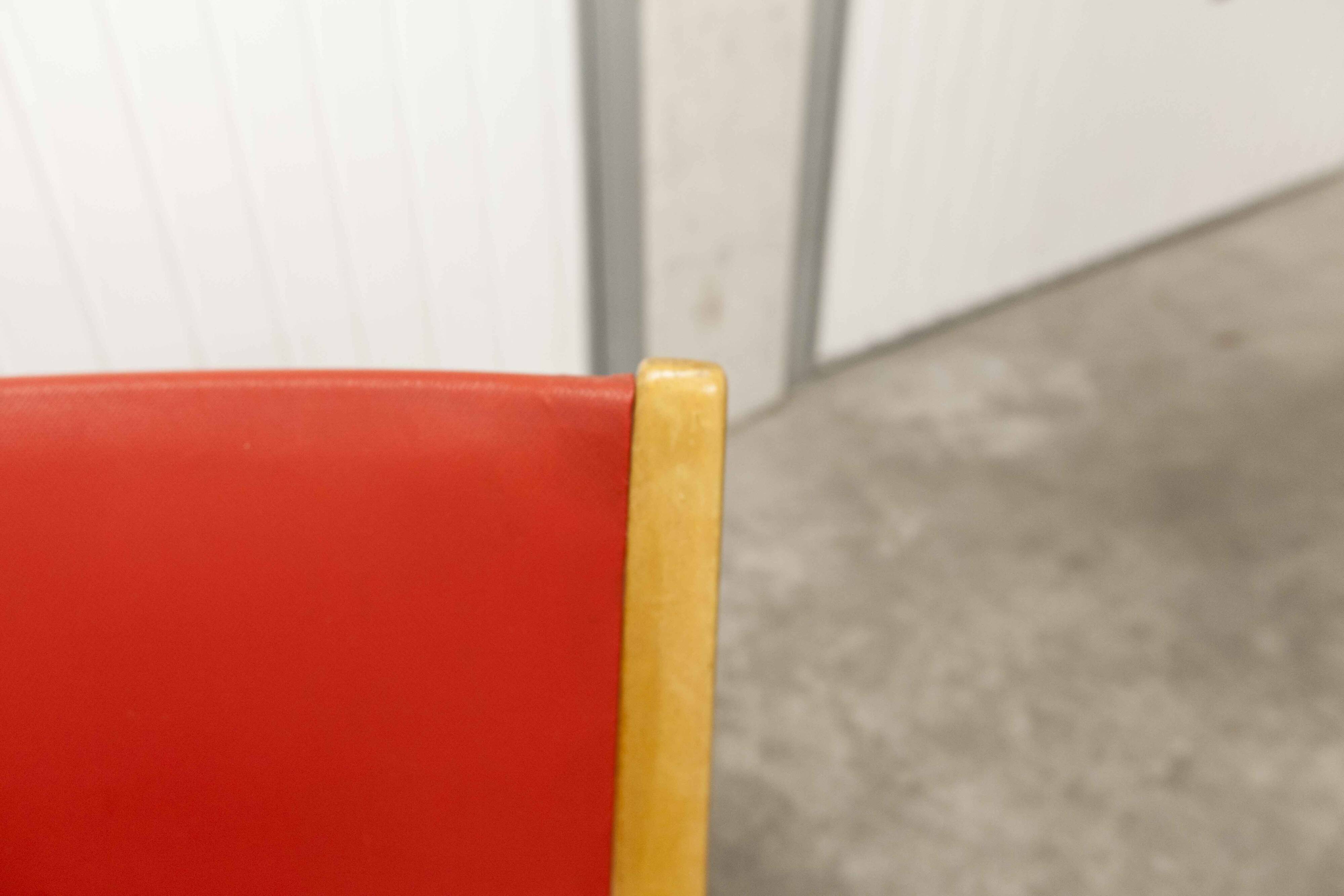 Bow wood armchair by Hugues Steiner 1960 red
