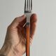 24 vintage stainless steel and orange plastic cutlery sets