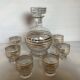Antique liqueur set with a gold rim.