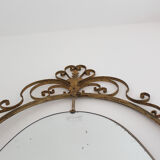 Oval mirror in art deco brass, Italy 1940s.