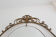 Oval mirror in art deco brass, Italy 1940s.