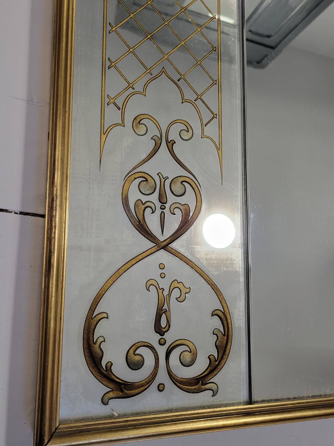 Eglomise brasserie mirror, late 19th century