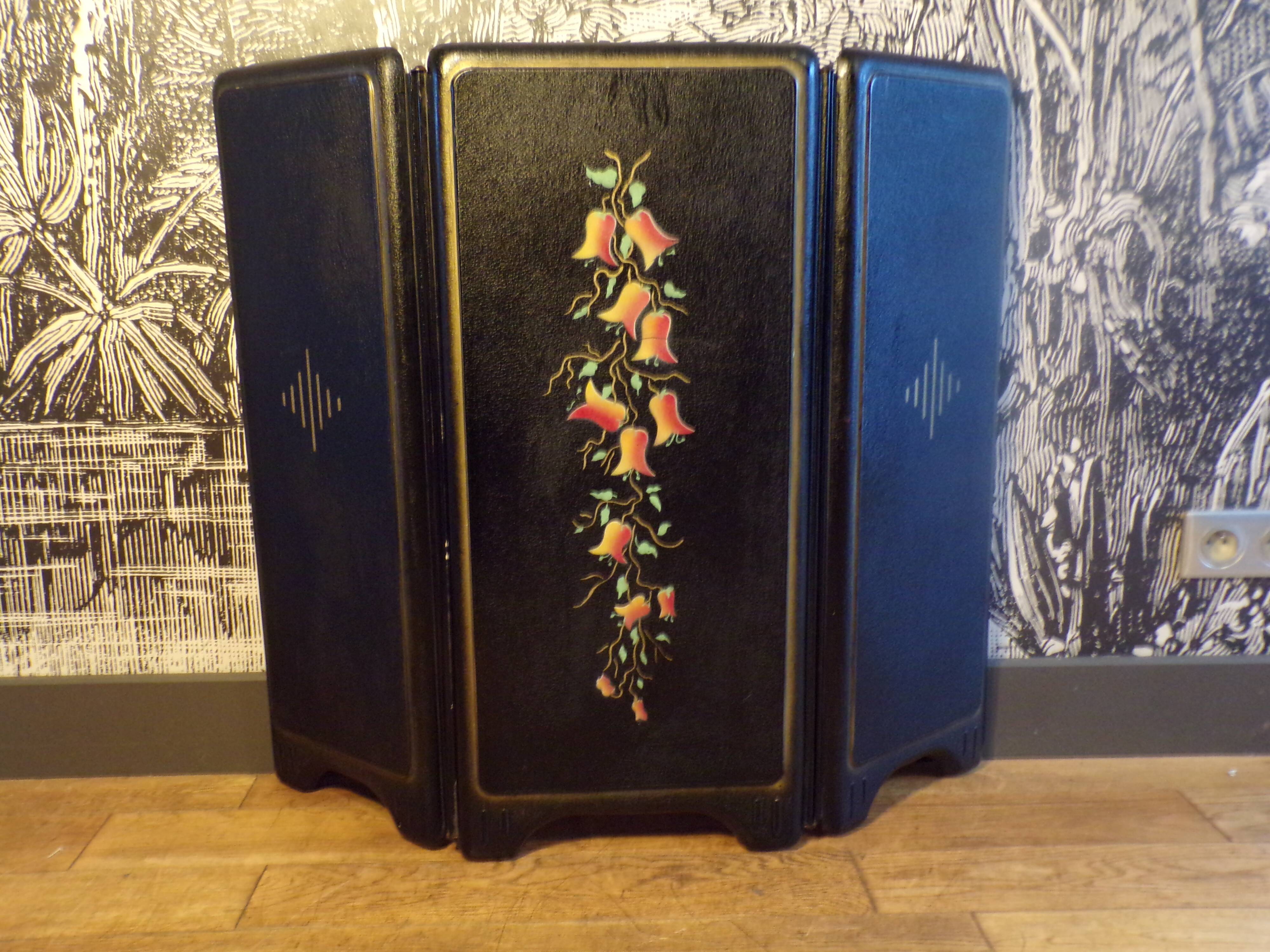 Old fireplace screen in painted sheet metal