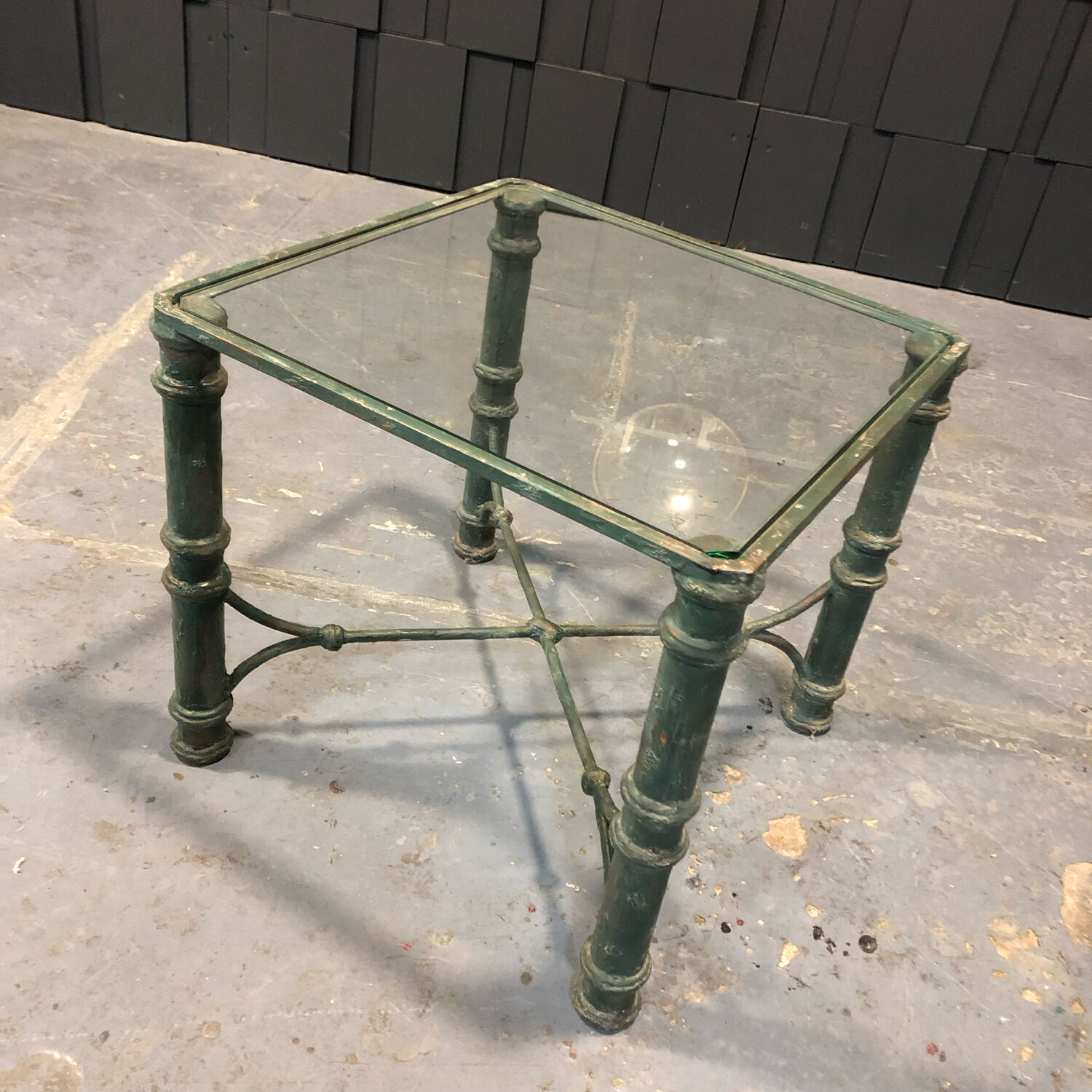 Iron and glass side table with antique patina