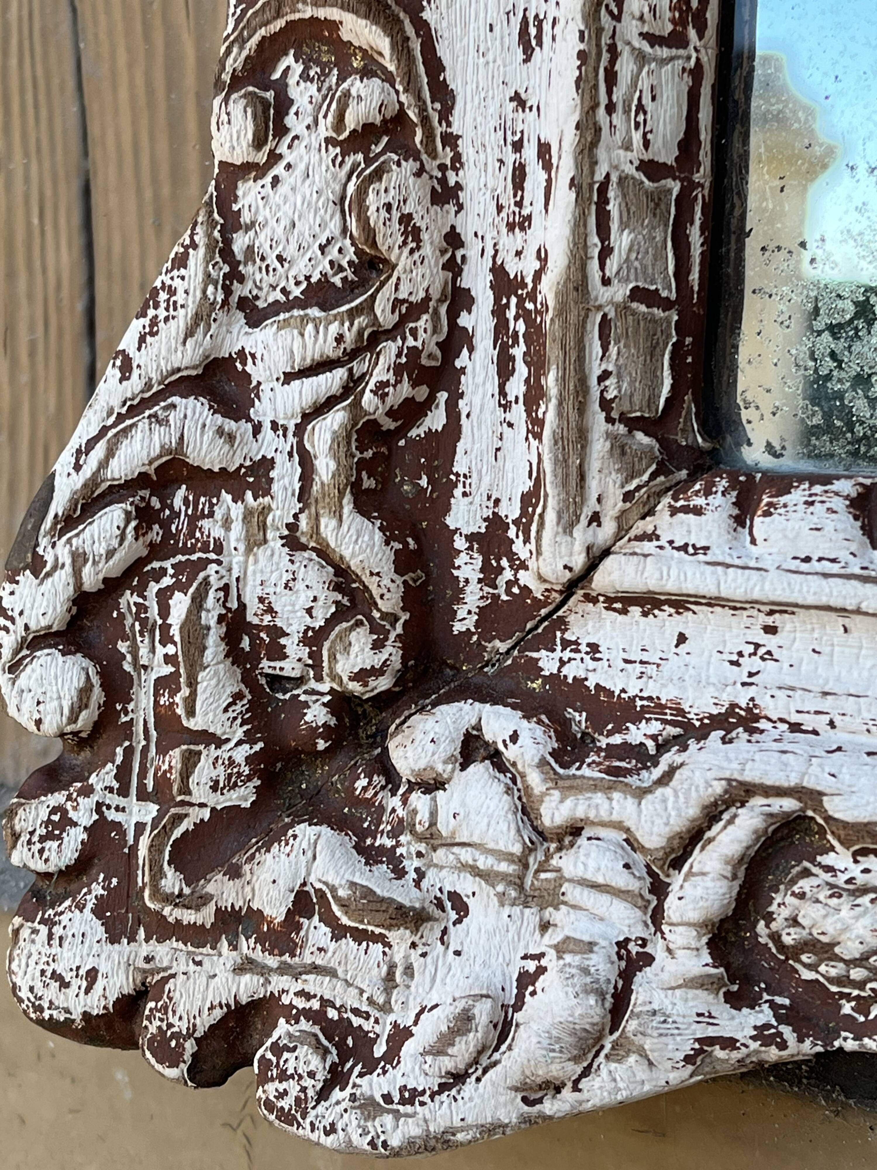 Carved wooden mirror