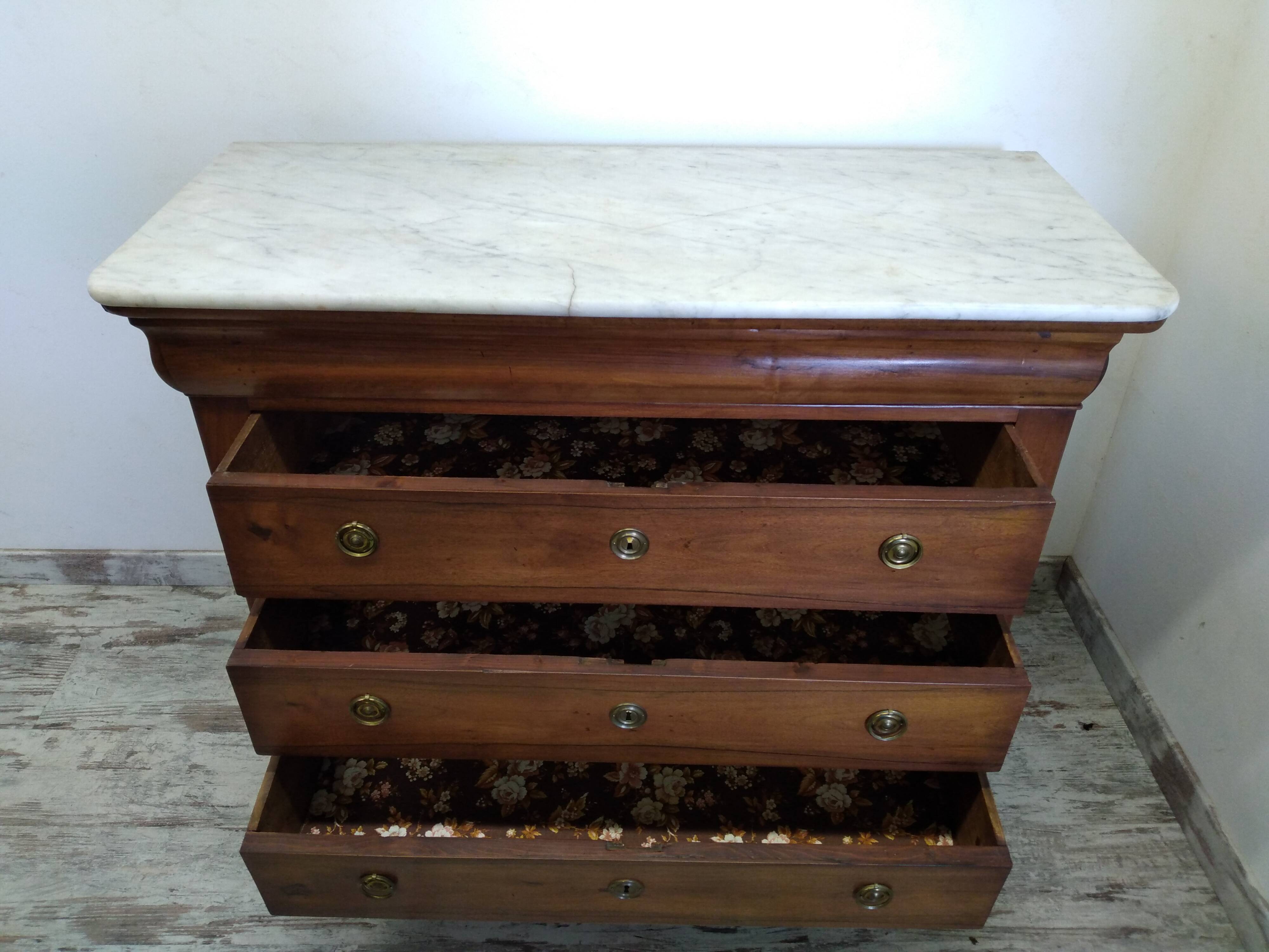 Old chest of drawers with marble