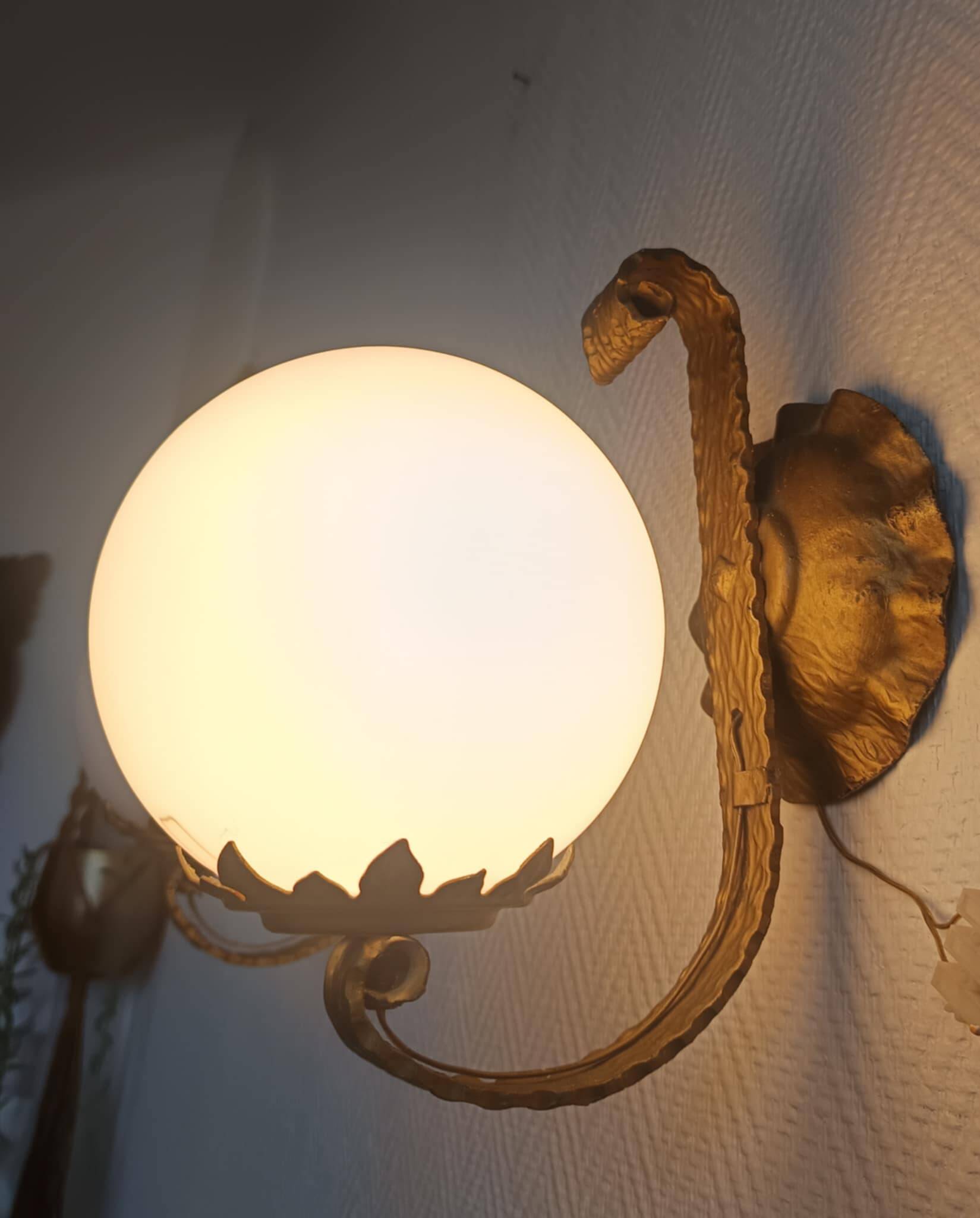 Pair of brutalist wall sconces in gilded metal from around 1970.