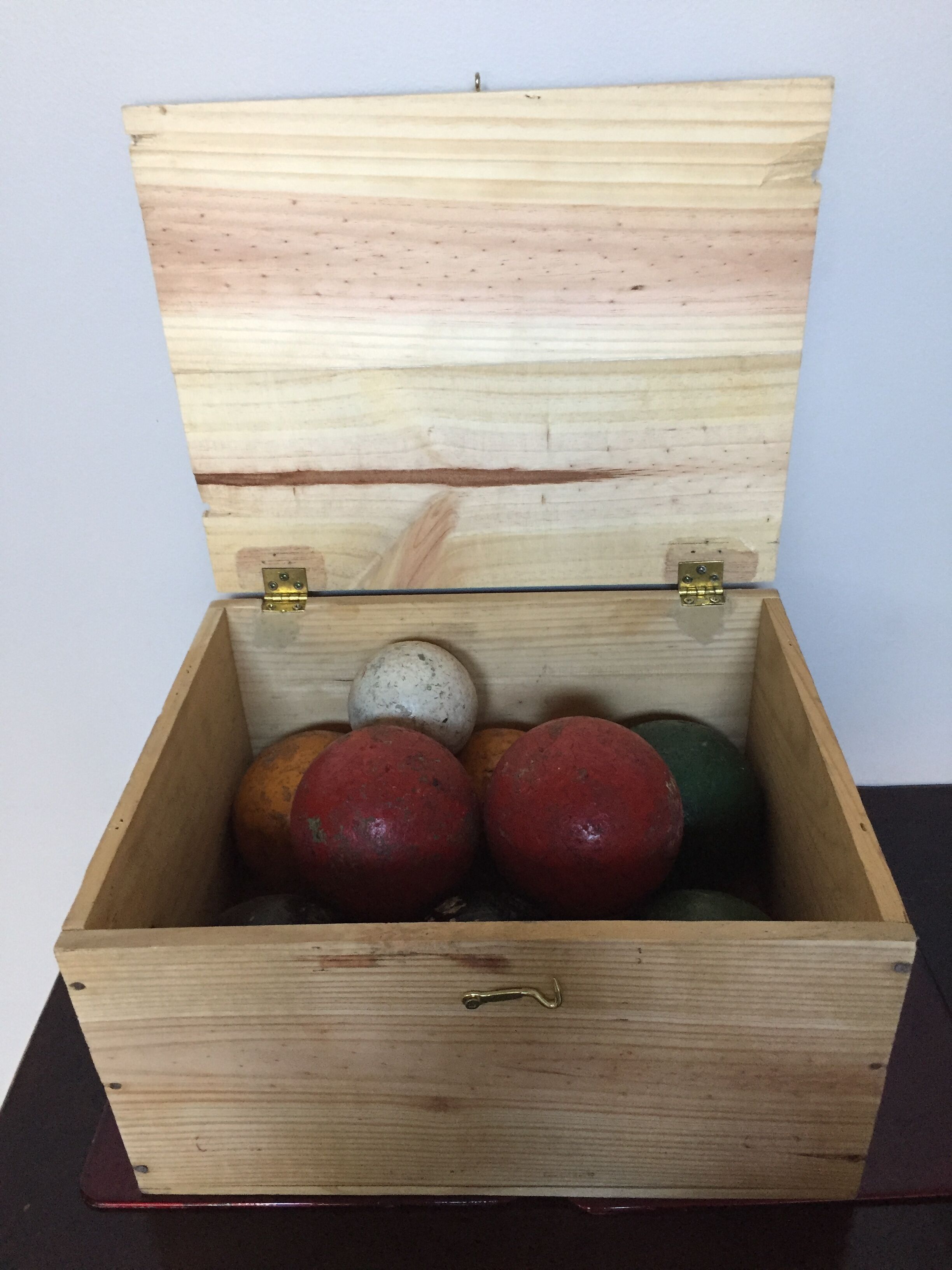 Very old game of wooden petanque balls with piglet
