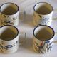 Set of 4 stoneware cups/mugs with blue floral designs, made in China.