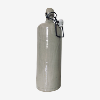 Beige varnished sandstone bottle