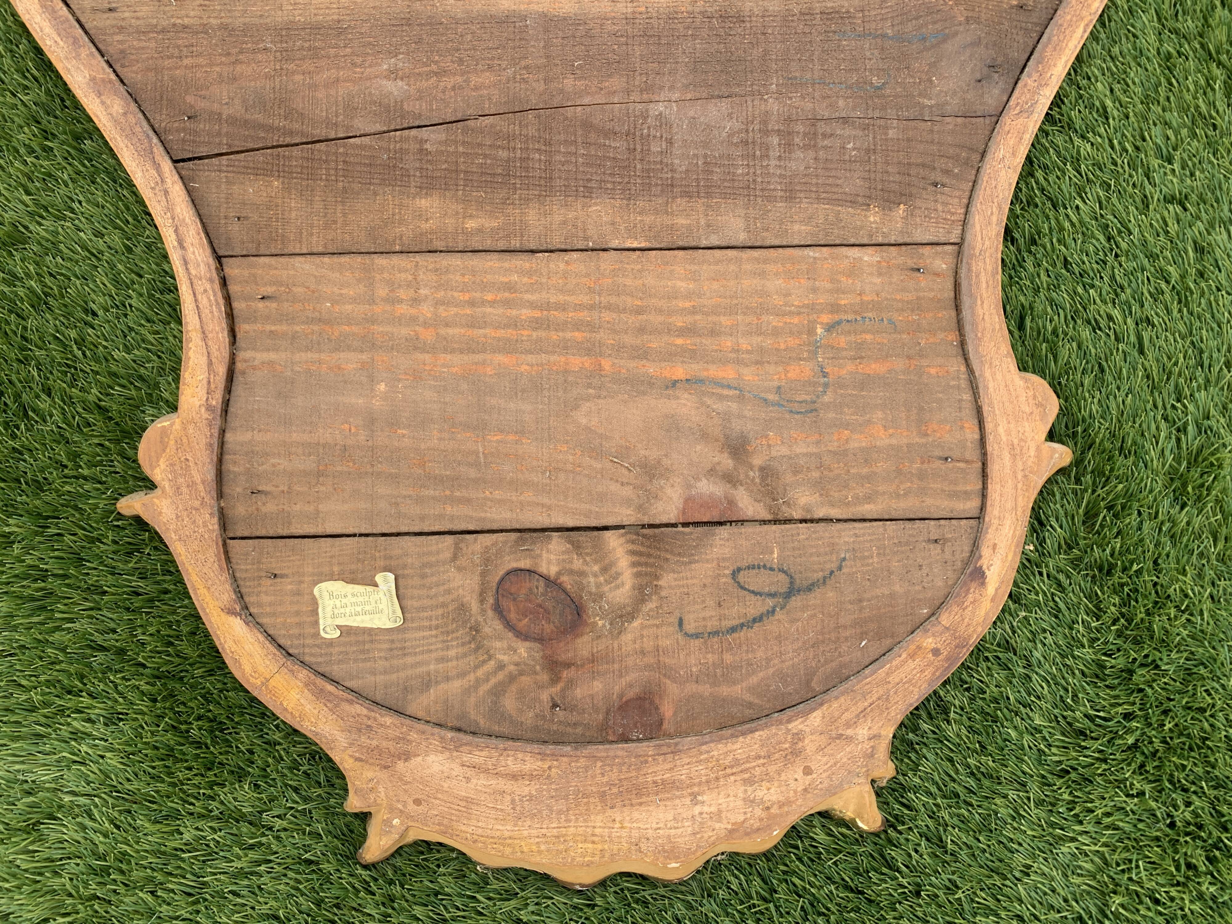 Old mirror in carved wood and gilded leaf, Louis XV rocaille style, twentieth century 59x87cm