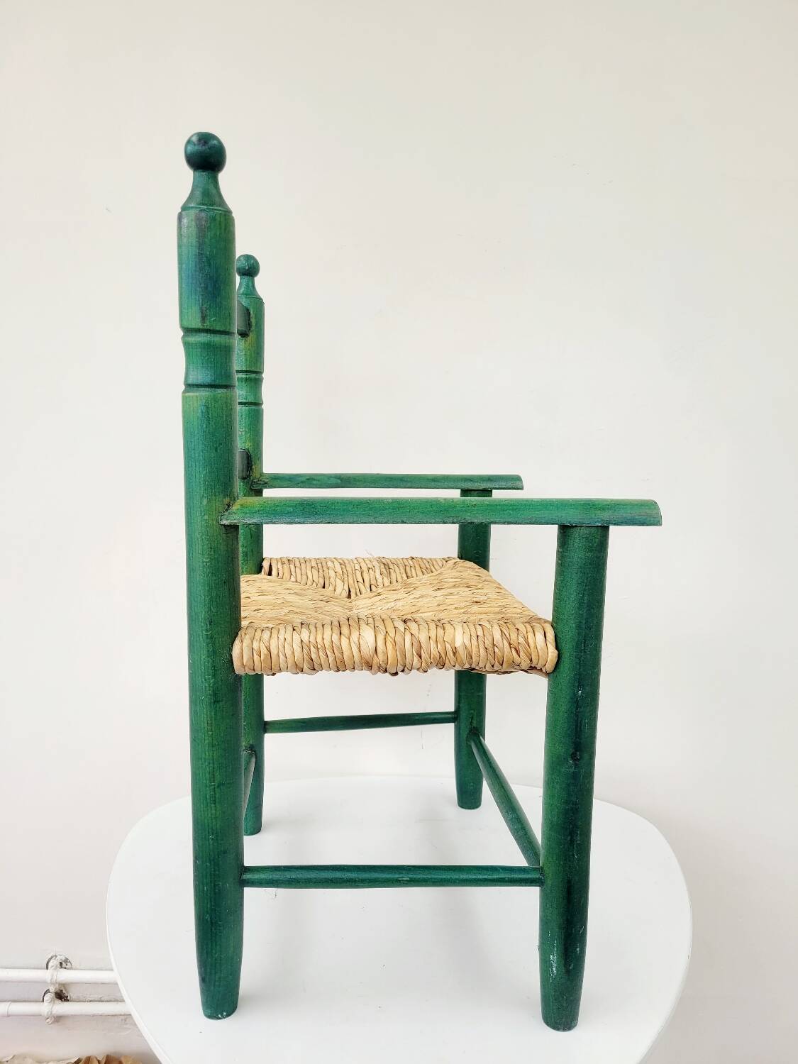 Small vintage children's chair in wood and green straw