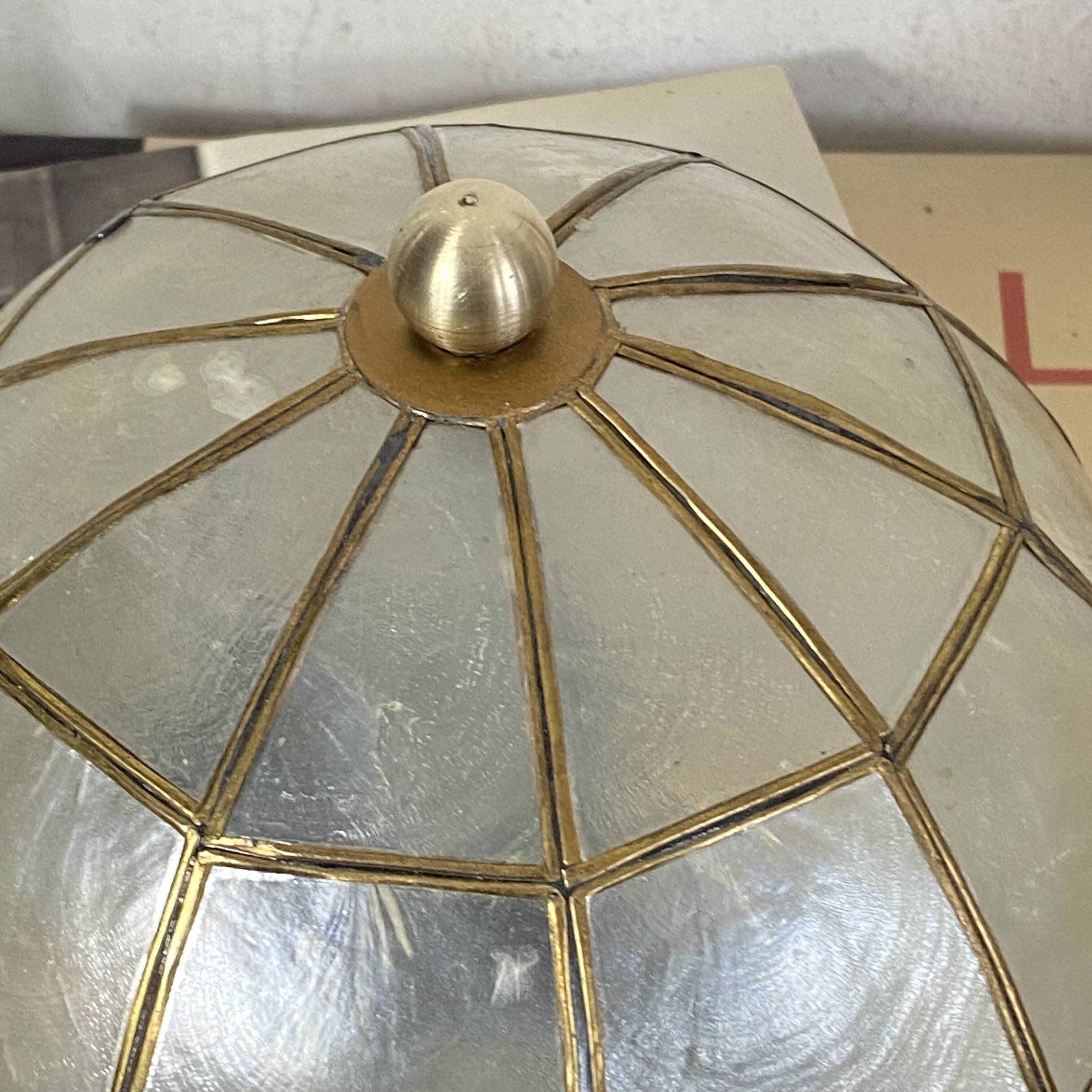 Small ceiling light with a mother-of-pearl shade from the 1950s.