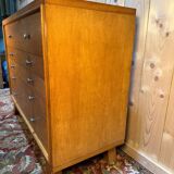 Vintage 1950s oak commode with tapered legs.