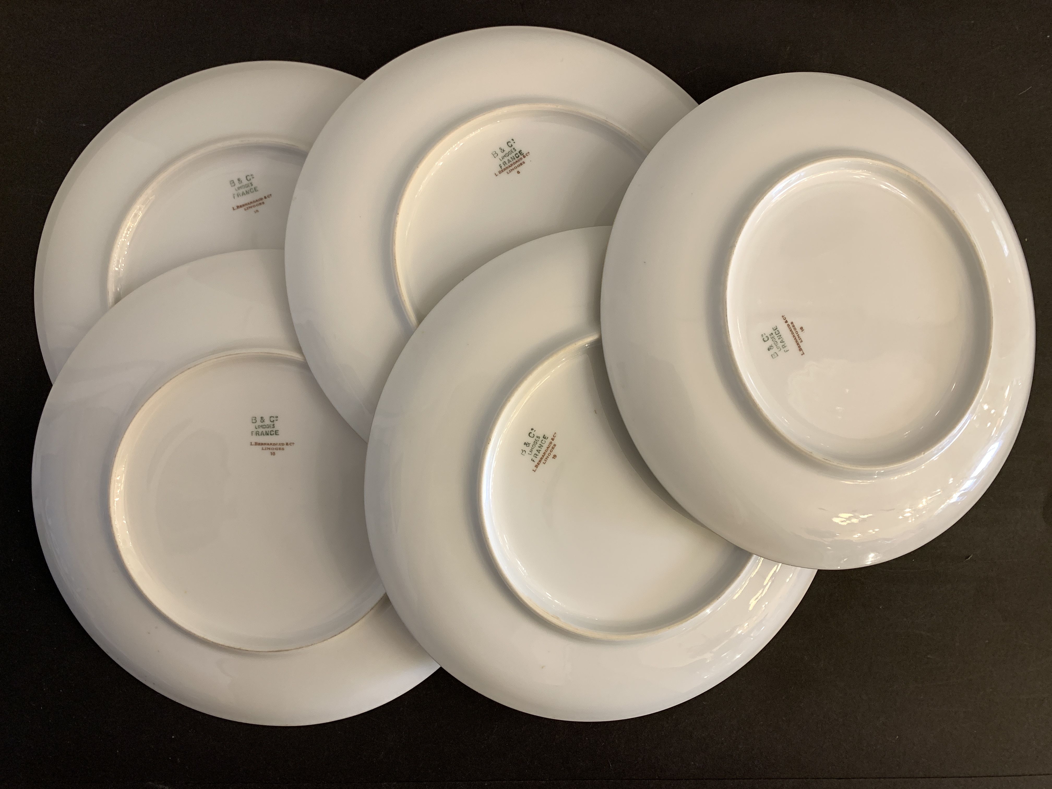 8 flat porcelain plates from Limoges Bernardaud, gilded Greek decoration, twentieth century