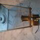 Antique lantern wall light in solid brass and glass.