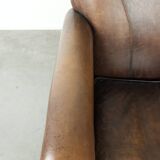Armchair / lounge chair made of sheepskin leather with characterful patina