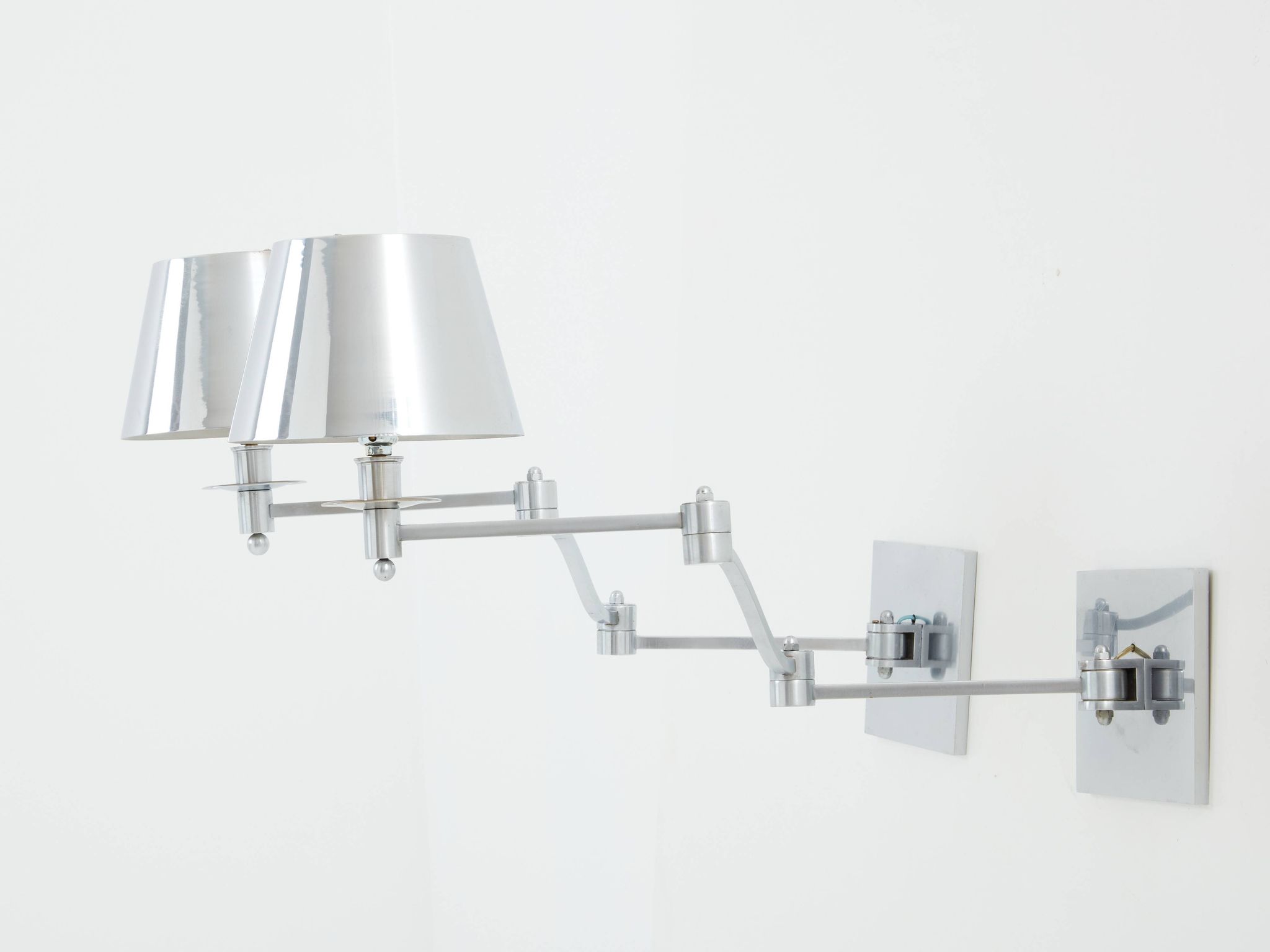 Pair of Maison Charles adjustable brushed steel wall lights circa 1960
