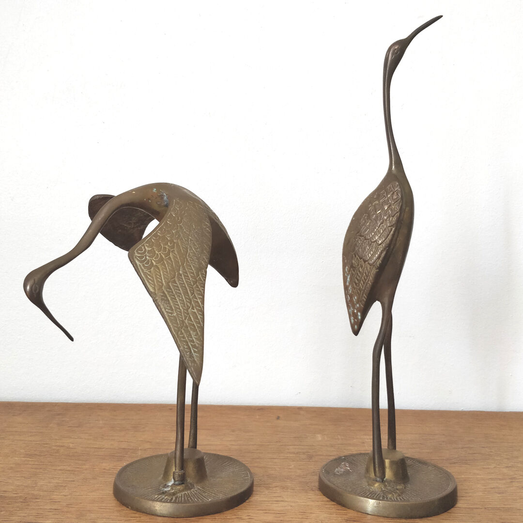 Couple herons in vintage brass