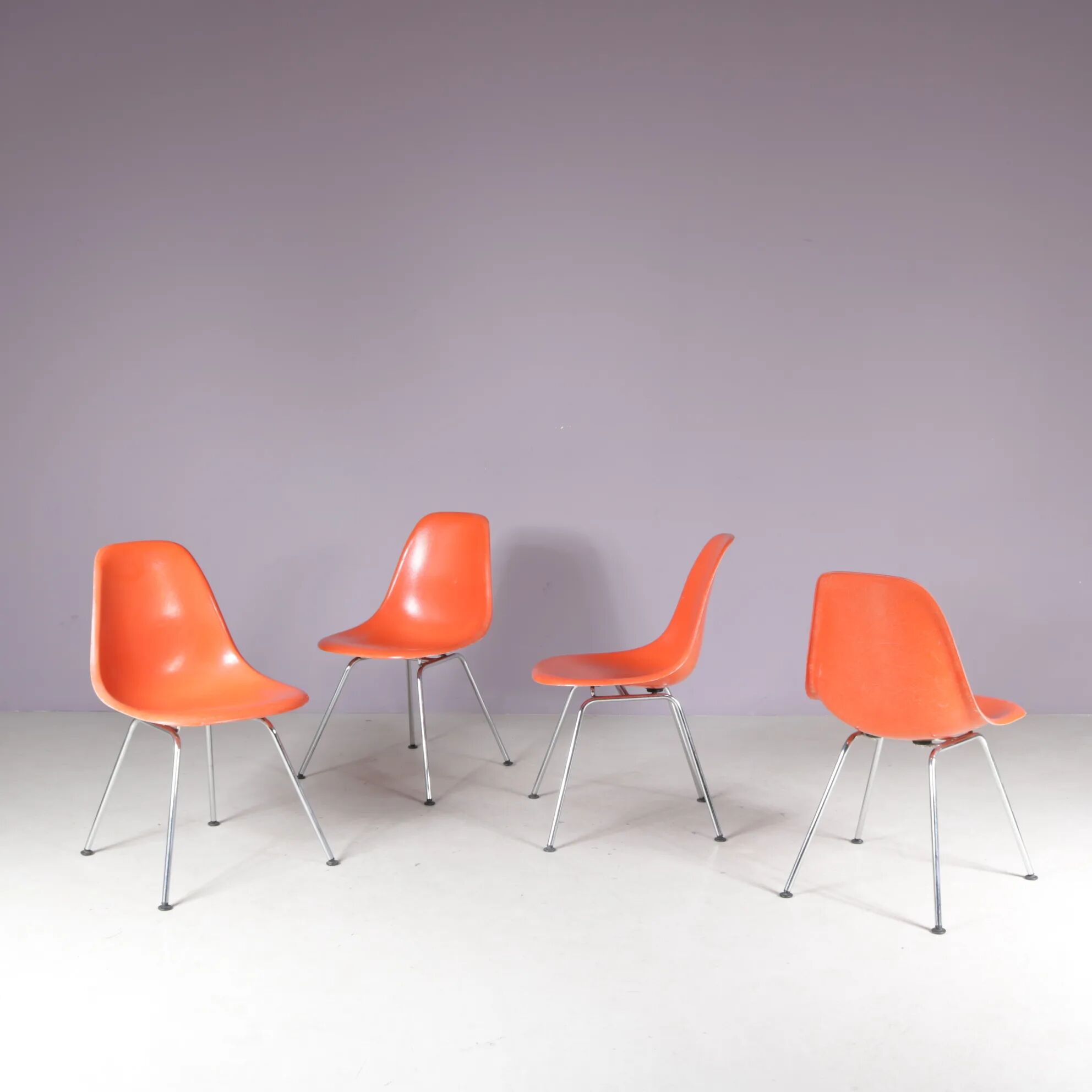1960s dining chairs in orange fiberglass on chrome metal H-base / Charles & Ray Eames / Herman Miller, USA