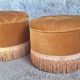 False pair of round Napoleon III poufs in ochre velvet, tufted with fringes.