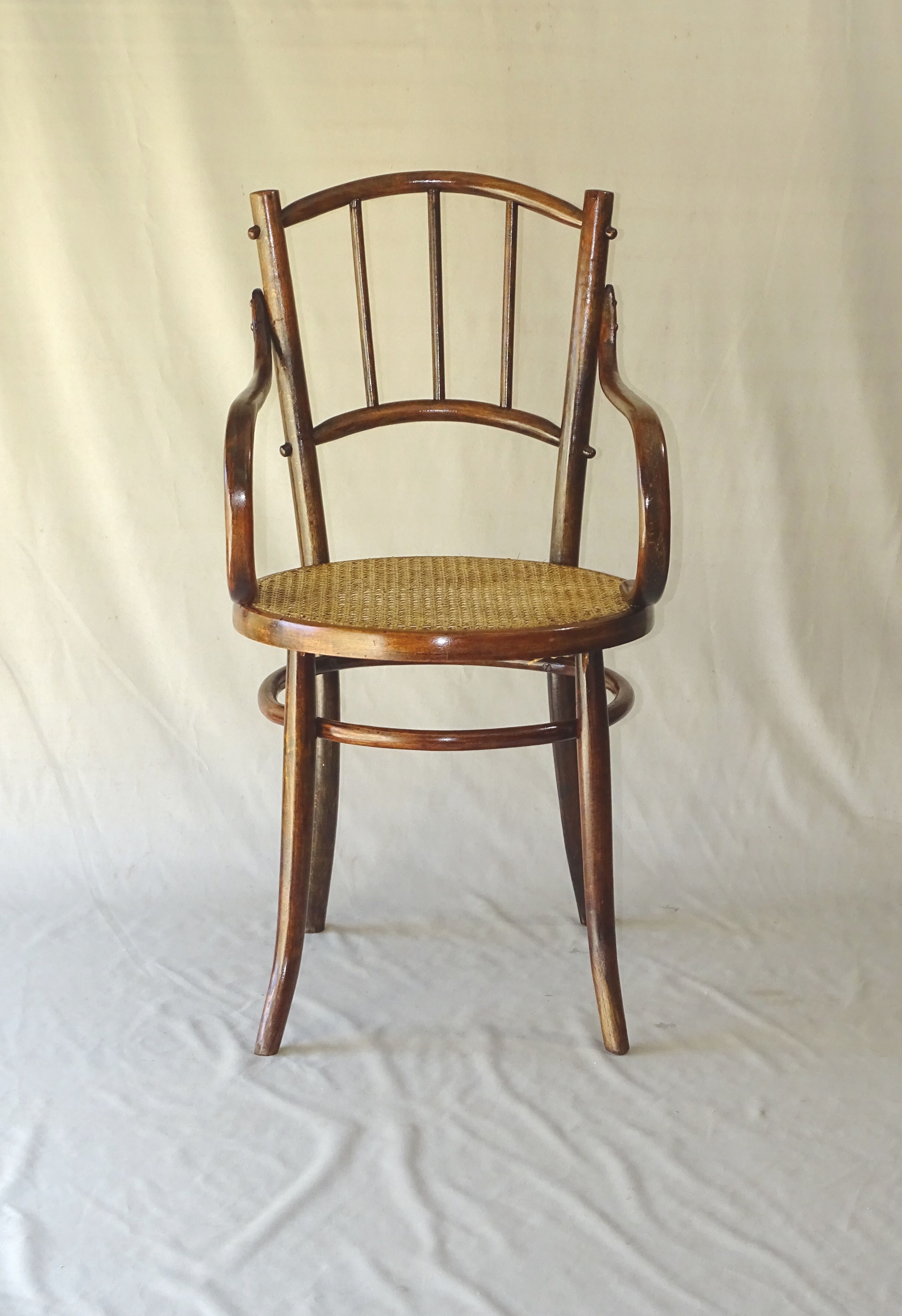 Small canned armchair; in curved wood, bistro, 1890