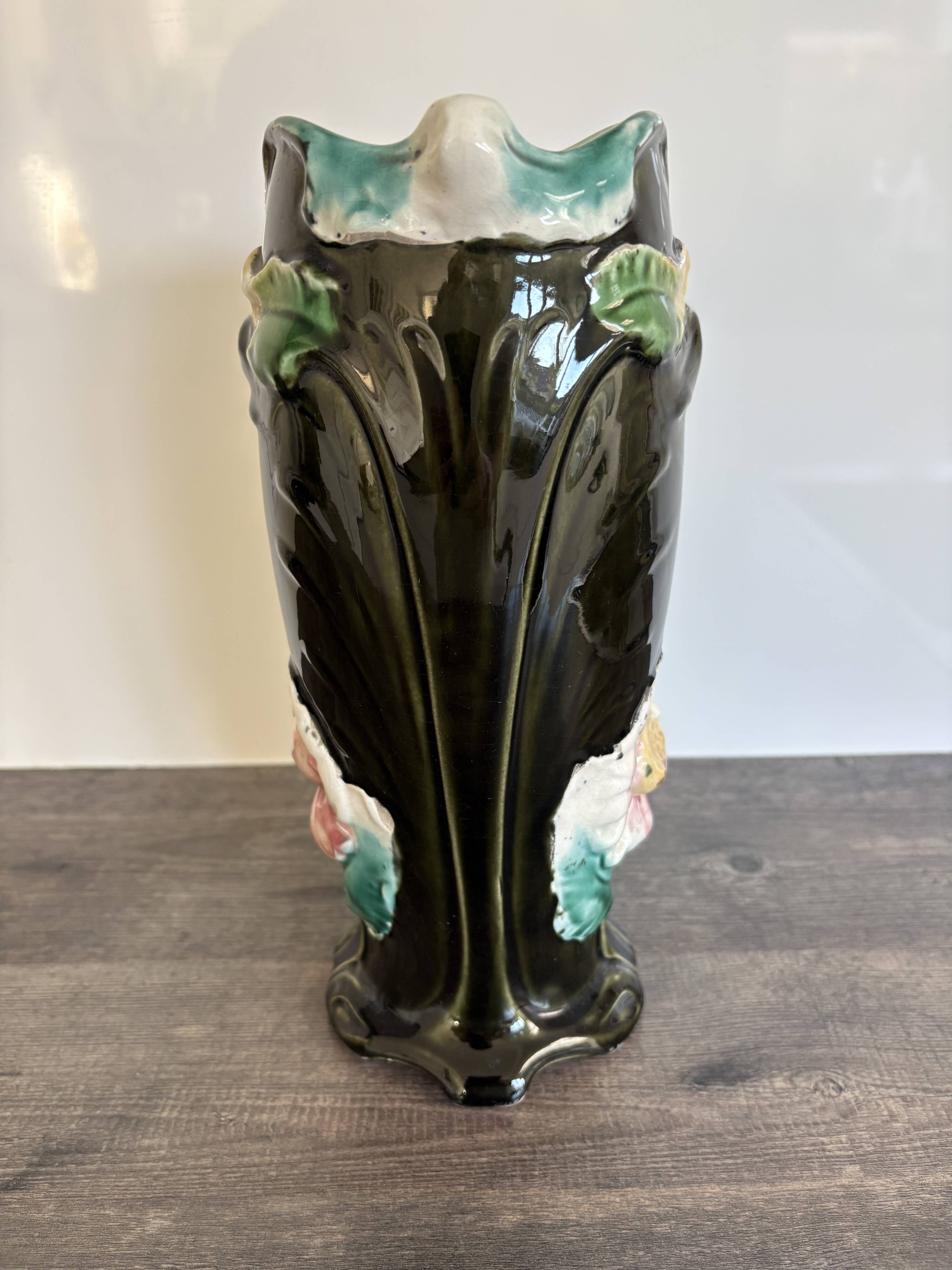 Antique ceramic vase by De Bruyn with floral decoration.