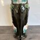 Antique ceramic vase by De Bruyn with floral decoration.