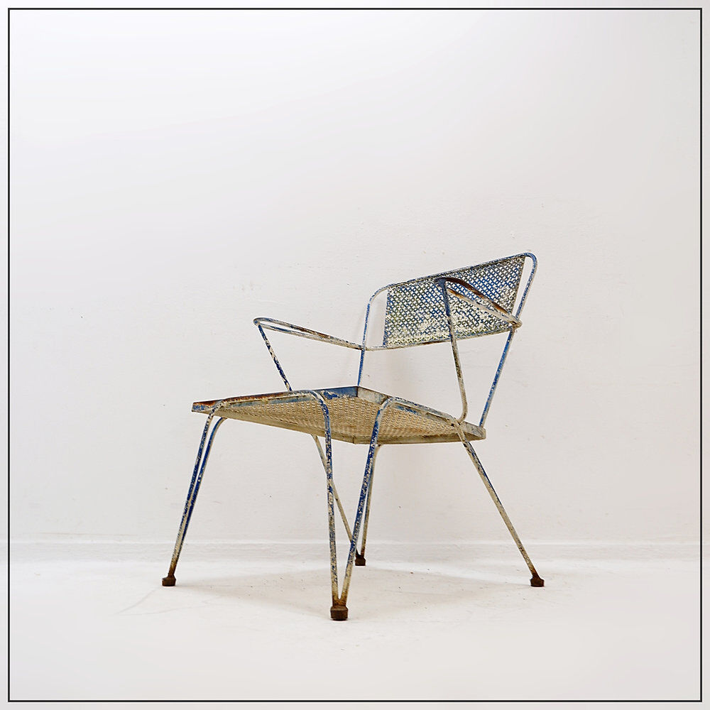 Vintage perforated metal armchair from the 1950s.