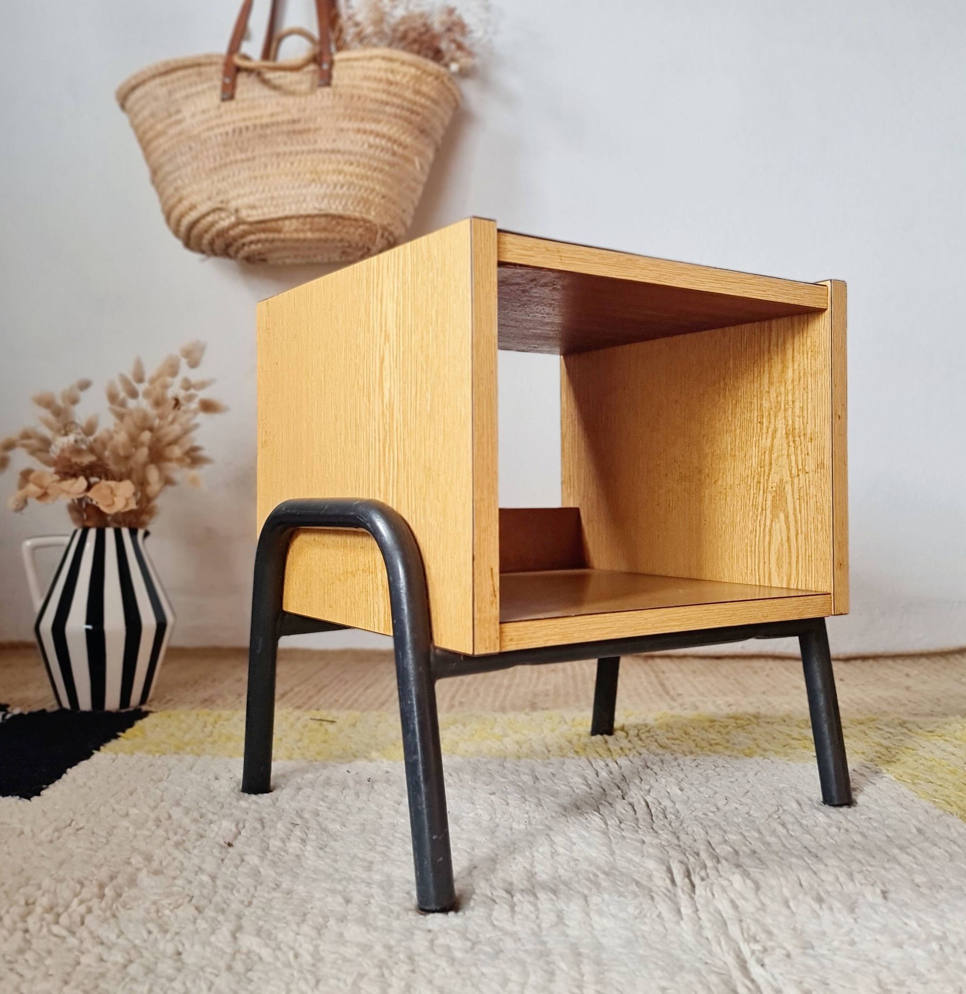 Bedside table - small wooden piece of furniture with a tubular metal base.